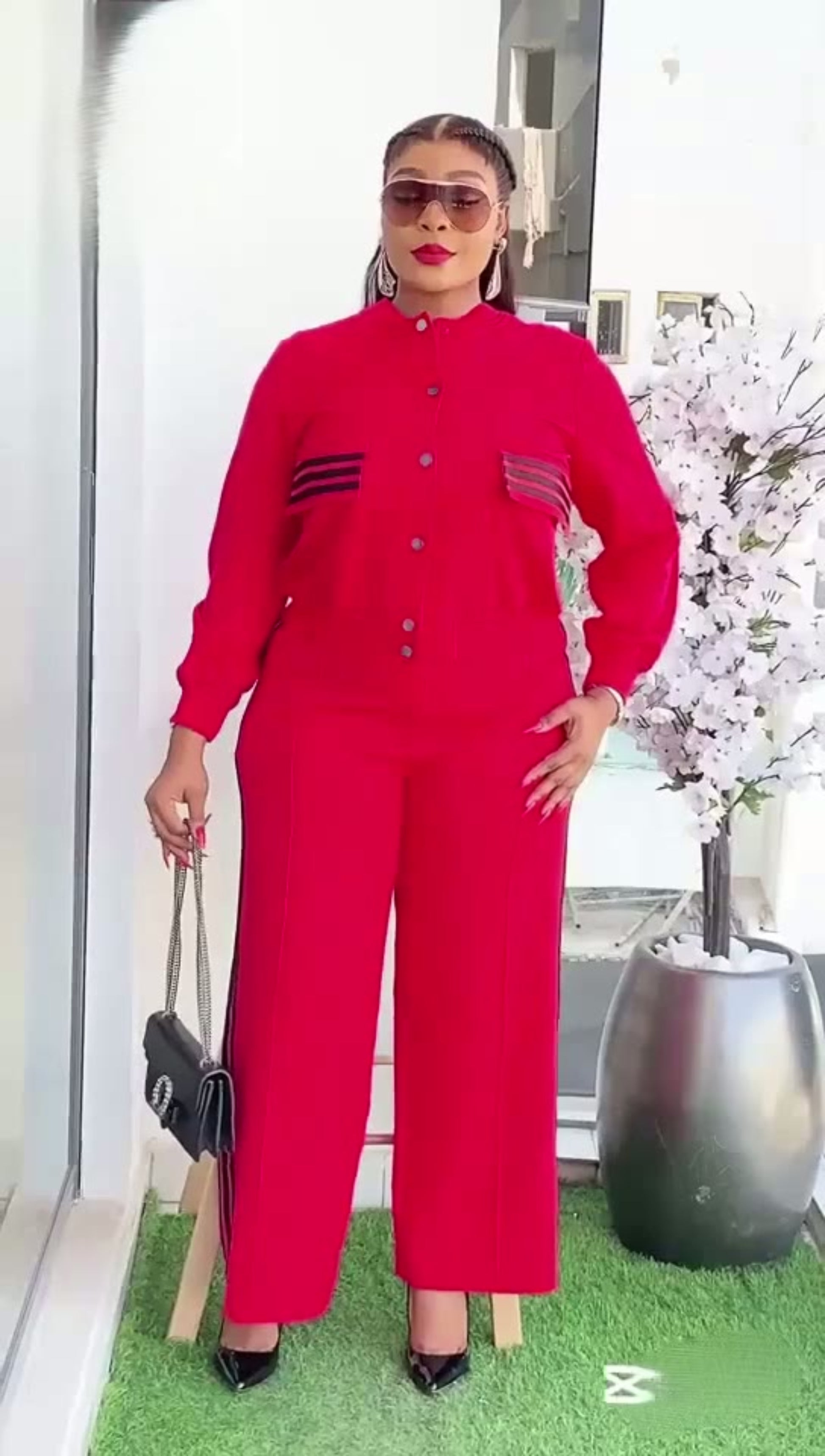 Person wearing a red outfit with a white background