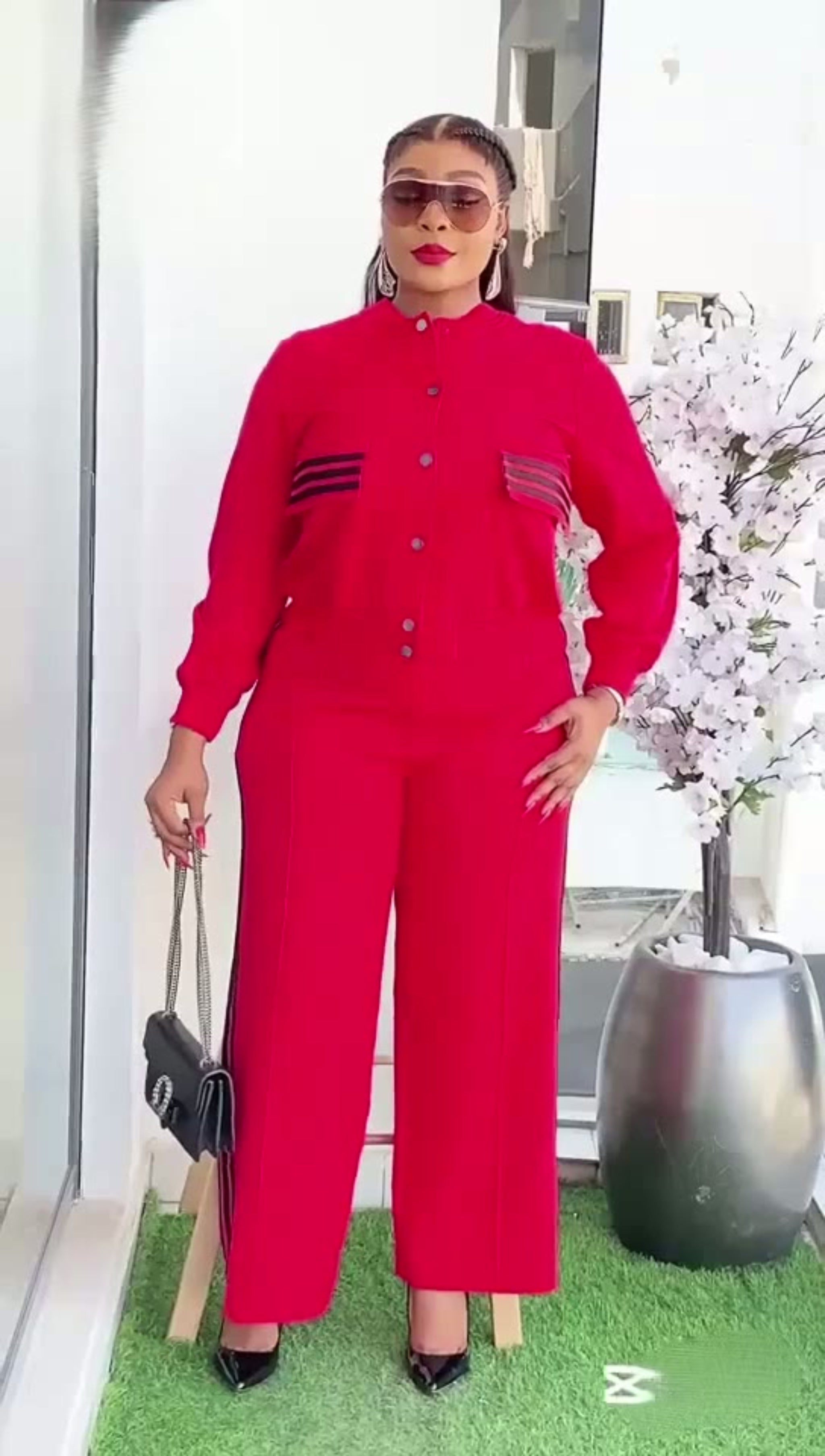 Person wearing a red outfit with a white background